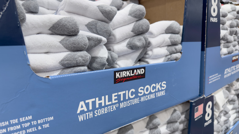 A view of several packages of Kirkland Signature athletic socks, on display at an American Costco