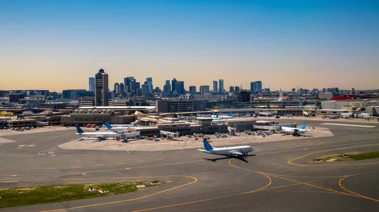 View of Boston Logan airport with Boston skyline in the background