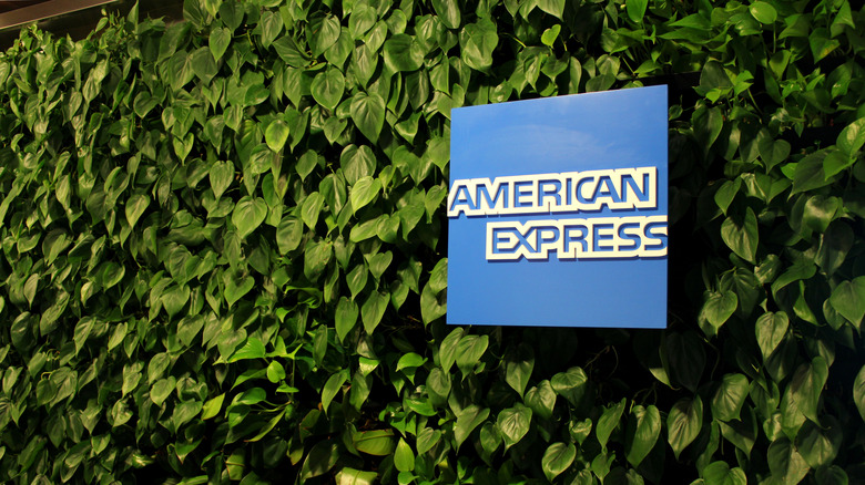American Express logo on a green living wall at the entrance to LaGuardia's Centurion Lounge
