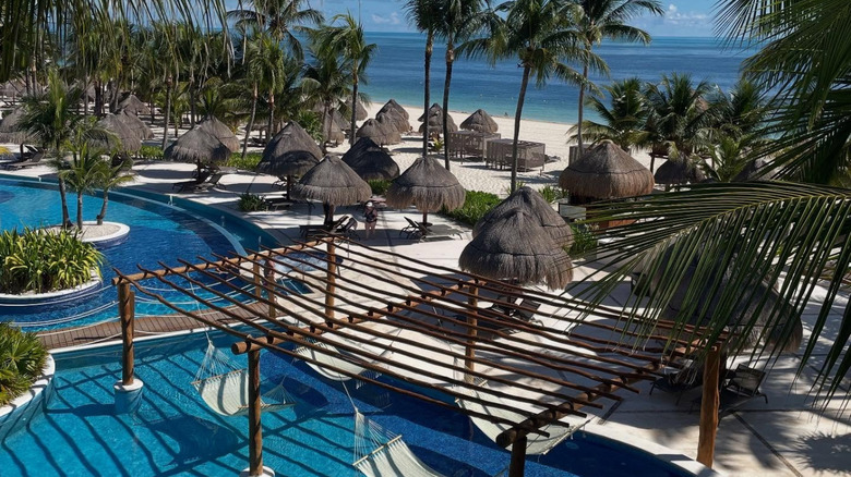 Aerial view of lounge chairs and pool at Excellence Playa Mujeres