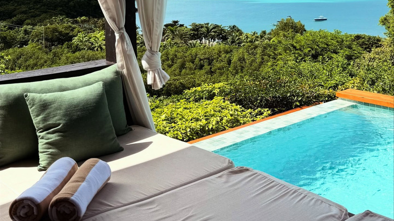 Lounge chair and pool at Hermitage Bay
