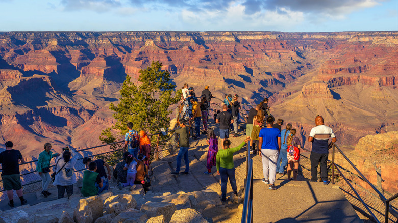Visitors take in the panoramic view from Mather Point on the South Rim of the Grand Canyon, Grand Canyon National Park, Arizona, United States.