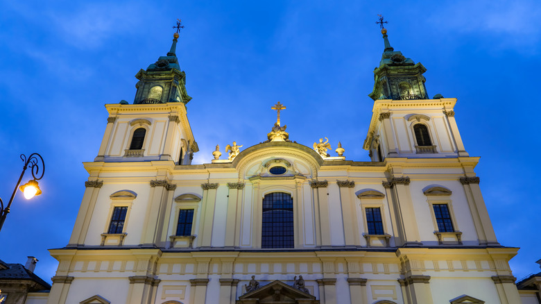 Exterior of Holy Cross Church in Warsaw, Poland, at night