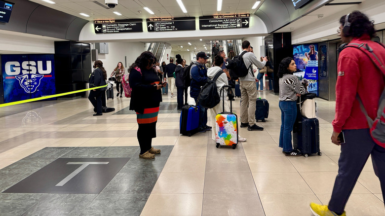 Travelers waiting for the Plane Train at ATL between terminals