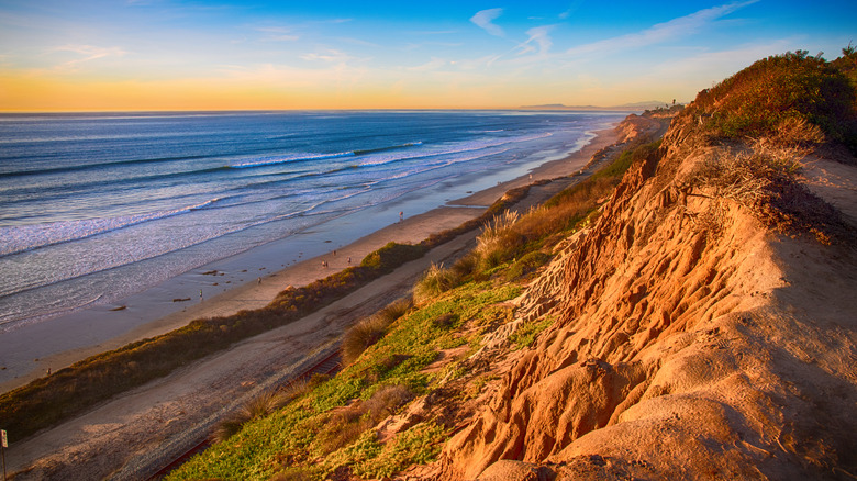 Rugged cliffs over the coastline at sunset in Del Mar, California