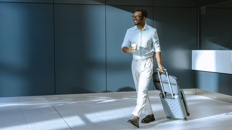 Someone walking with a suitcase