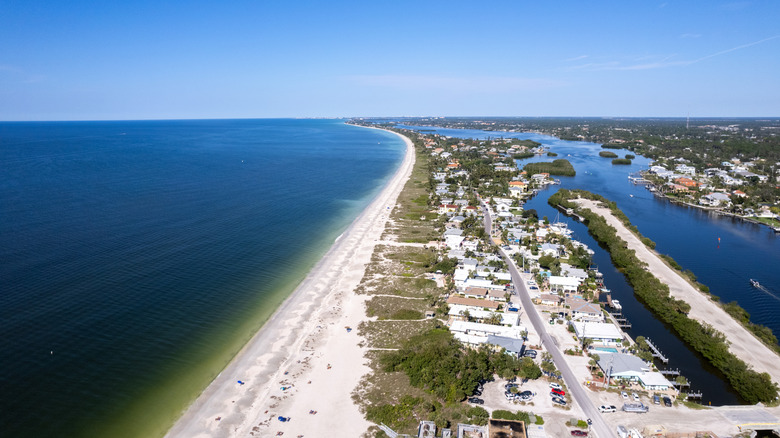 Aerial view of a long, white-sand beach