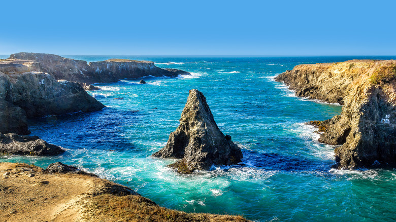 Picturesque rocks off the coast of Mendocino in blue water