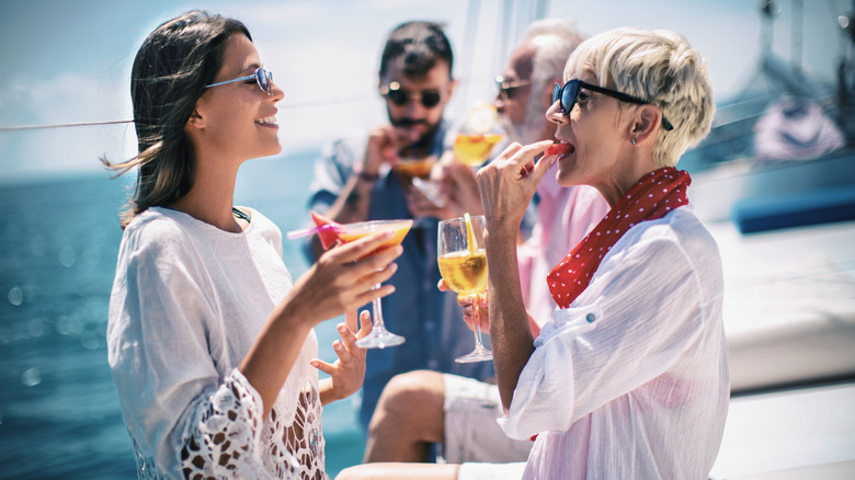 People drinking alcoholic beverages on a cruise ship