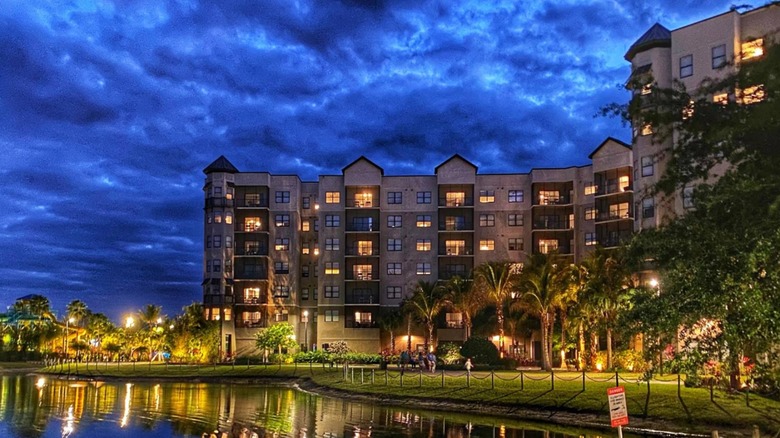 The back of The Grove Resort building at night