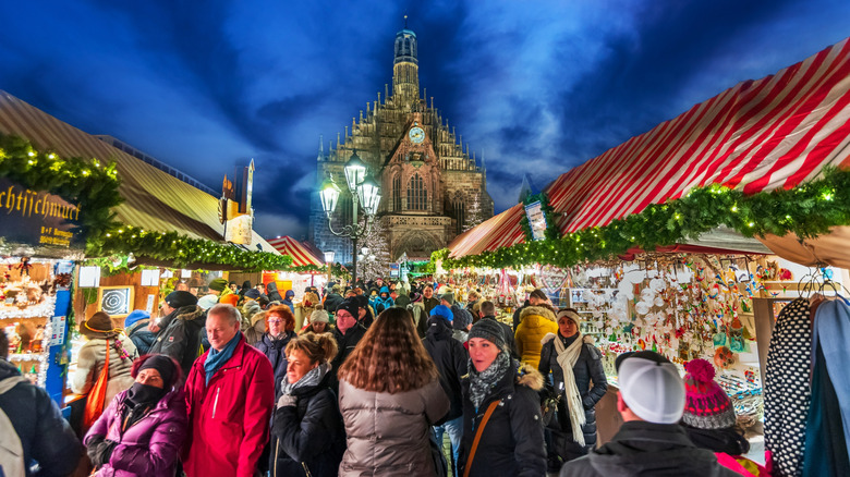 A crowd gathered between stalls at the Christmas Market in Nuremberg