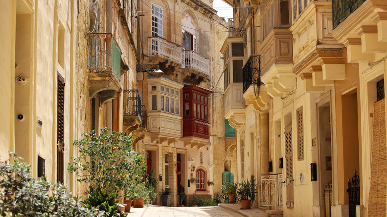 A charming side street in Valletta, Malta, with yellow buildings