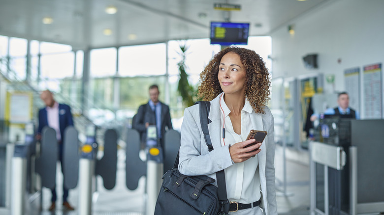 Person on their phone at the airport