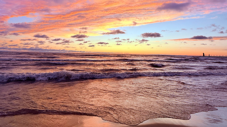 A sunset over the beach in South Haven, Michigan