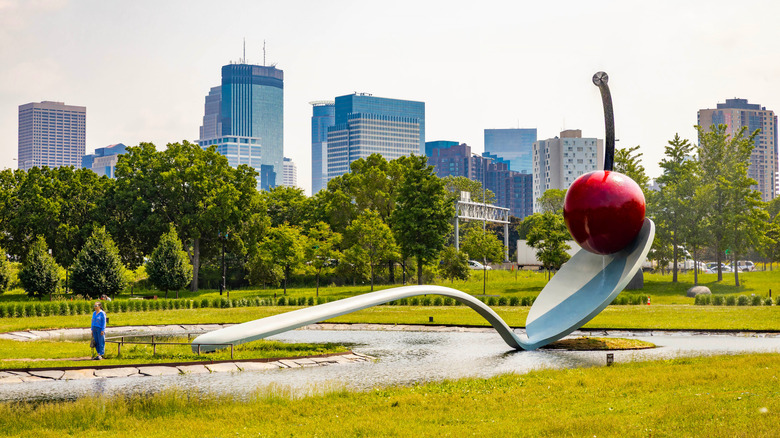 A giant spoon holding a cherry in the Minneapolis Sculpture Garden