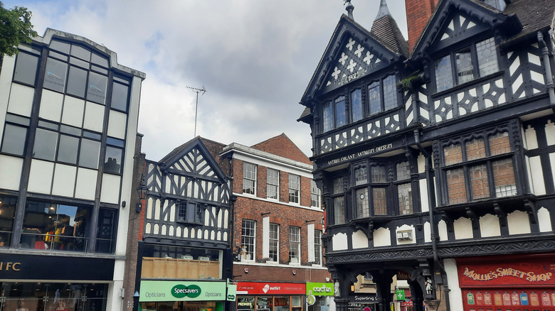 Chester's main street featuring black-and-white timbered buildings in the Tudor Revival and Victorian styles