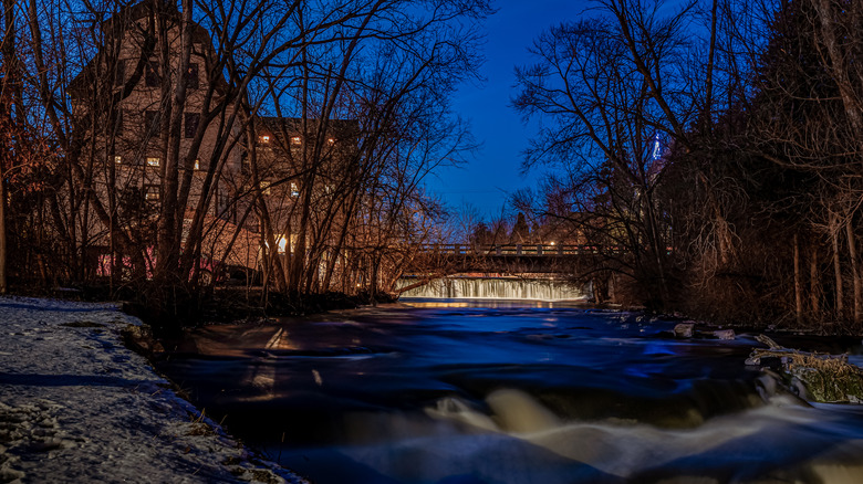 The old mill and dam in Cedarburg Wisconsin decorated for the holidays