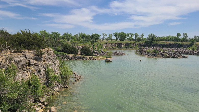 A view of the clear water from the limestone cliffs surrounding Lehigh Lake at Lehigh Portland State Park in Kansas