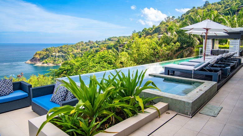 View of luxury villa in Phuket, Thailand, with an infinity pool overlooking the sea