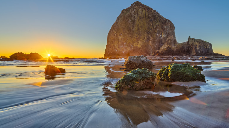 A sunset over sea stacks near Haystack Rock in Cannon Beach, Oregon
