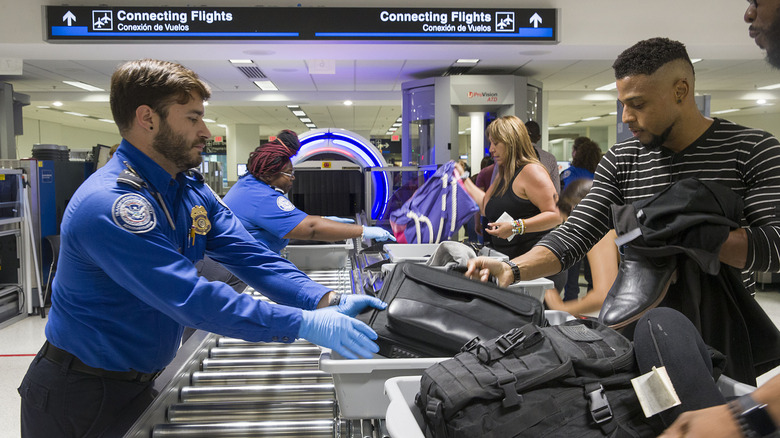 People going through a TSA security checkpoint