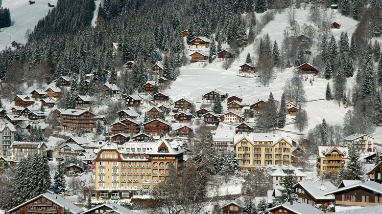 Houses and snow on the ground in Wengen, Switzerland, in winter