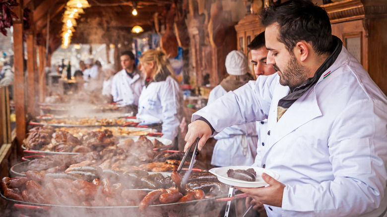A vendor serves up some food in Budapest