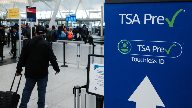 People pass through a TSA PreCheck security checkpoint at John F. Kennedy International Airport.