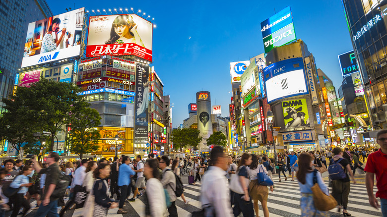 View of pedestrians scrambling at Shibuya Crossing, the busiest intersection in the world, Tokyo, Japan