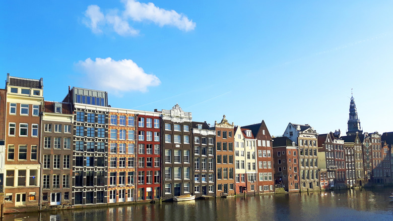 Row of tall Dutch buildings along a canal