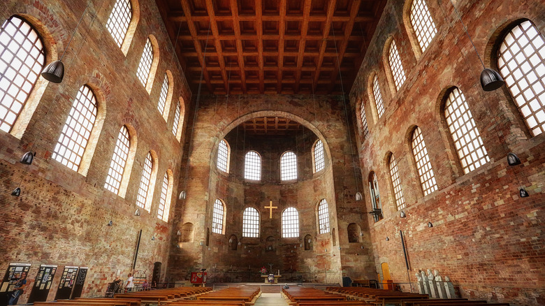Interior view of Trier's Basilica of Constantine, known as the Throne Rome, with high ceilings and tall windows