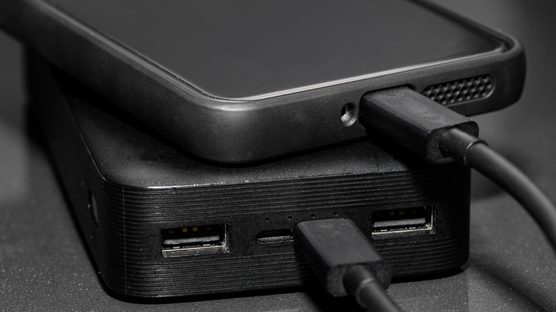 Portable power bank charging a phone