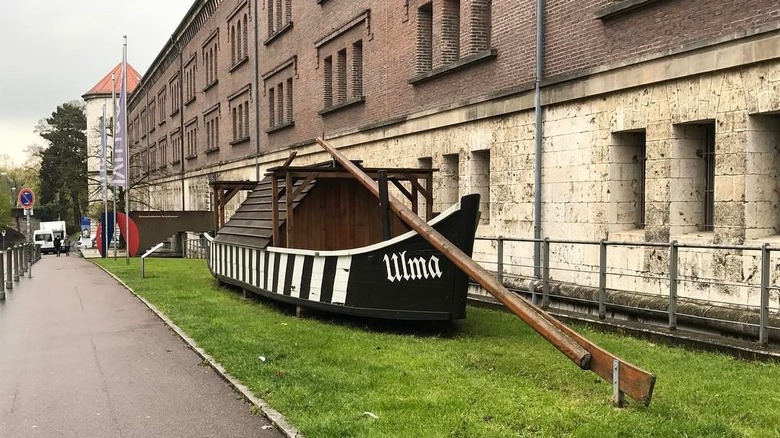 A historic wooden boat outside of the Danube Swabian Central Museum