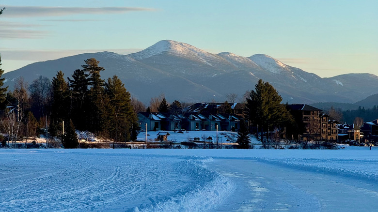 Winter in the Adirondack Mountains, with snow covering the ground and mountains in the background