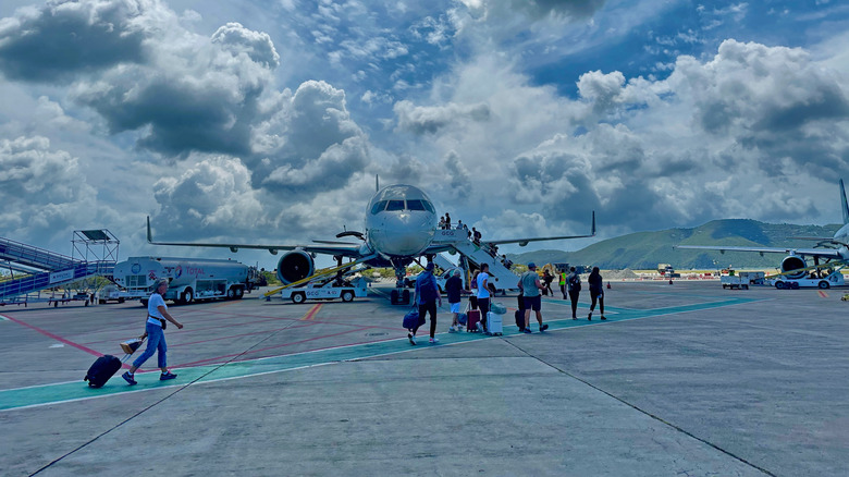 American Airlines Airplane operation and passengers boarding in Cyril E. King Airport in US Virgin Islands