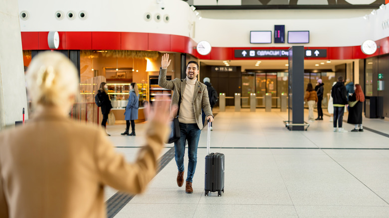 Someone greeting a loved one at the airport after a flight