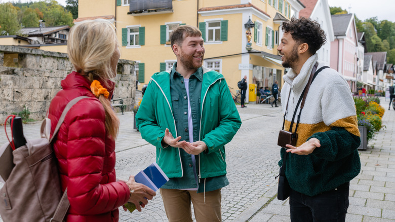 A traveling couple meeting a local in Germany