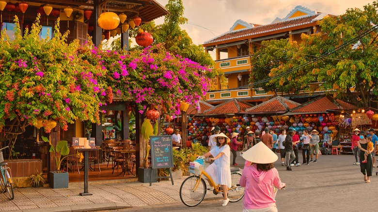People walk around the historic city of Hoi An, Vietnam