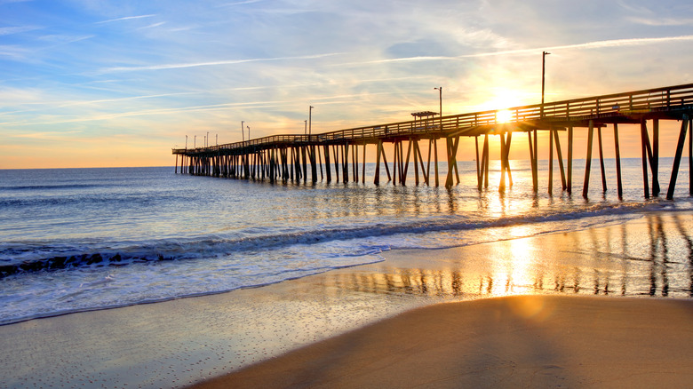 A large pier in the ocean at Virginia Beach at sunrise