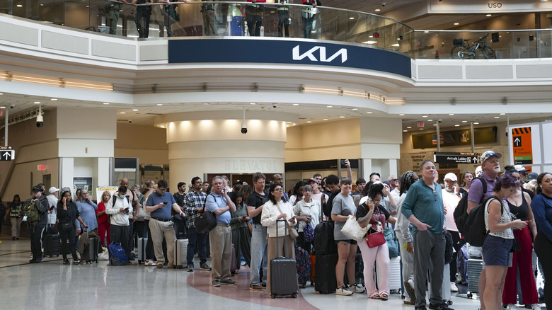 Crowds of people in line at an airport