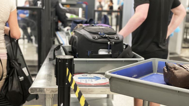 People going through a TSA checkpoint at the airport