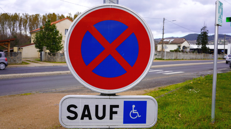 Blue sign with a red X in France