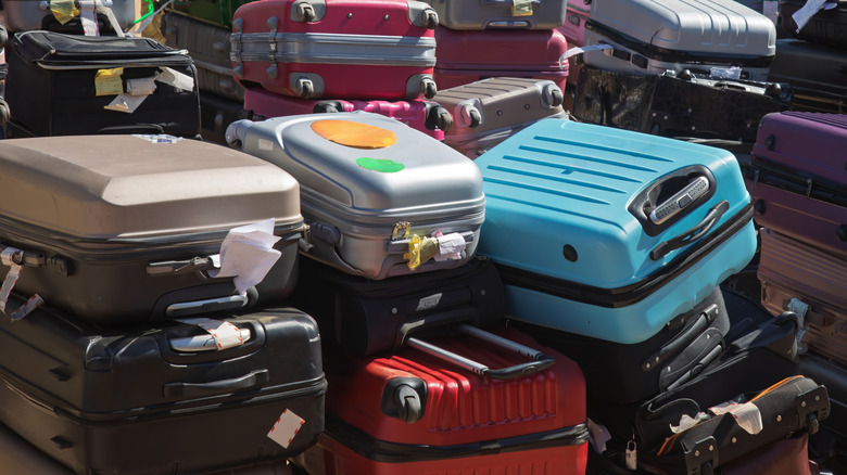 A stack of lost suitcases and luggage