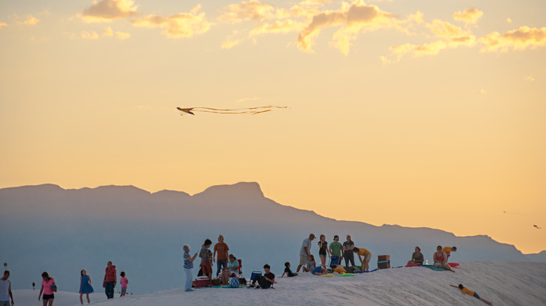 Visitors waiting for a full moon at White Sands National Monument, now White Sands National Park, in New Mexico
