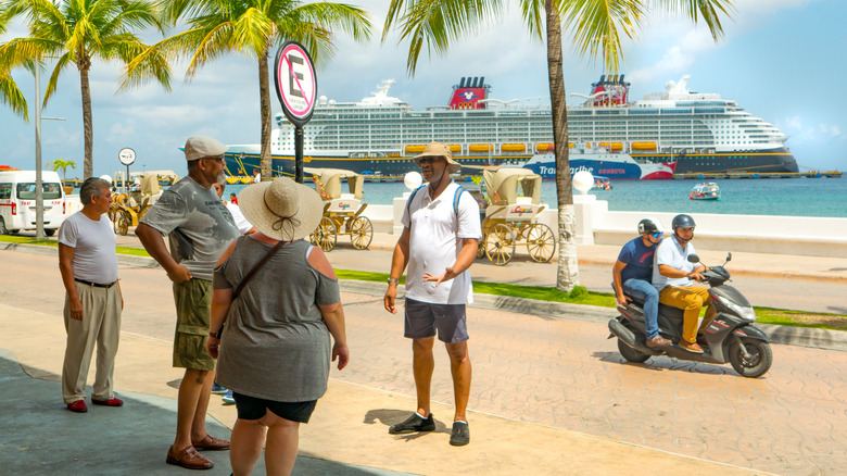 A local guide taking tourists on a tour of Cozumel