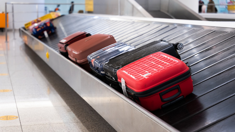Suitcases on the luggage carousel at the airport