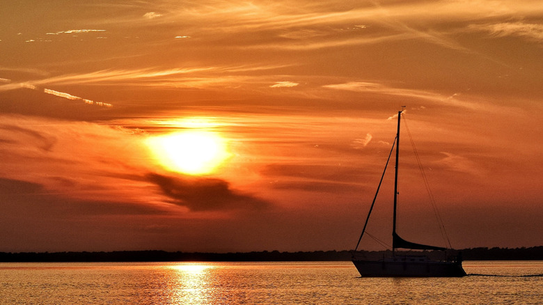 Sunset on Petenwell Lake, with a boat on the water