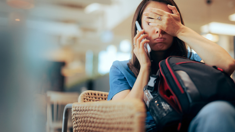 Traveler looking stressed at the airport