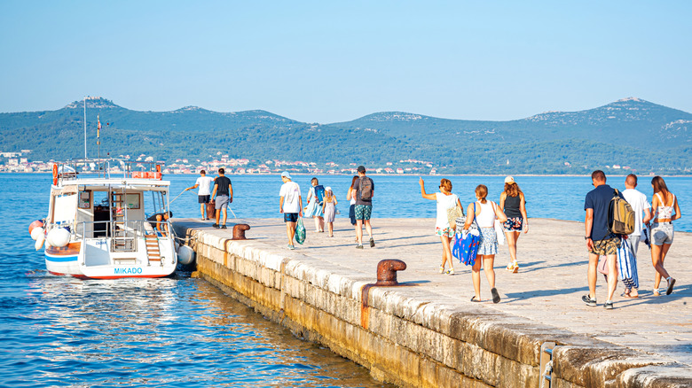 An excursion boat picks up tourists in Zadar