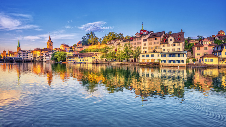 Zurich's Old Town reflected in the Limmat River during sunrise